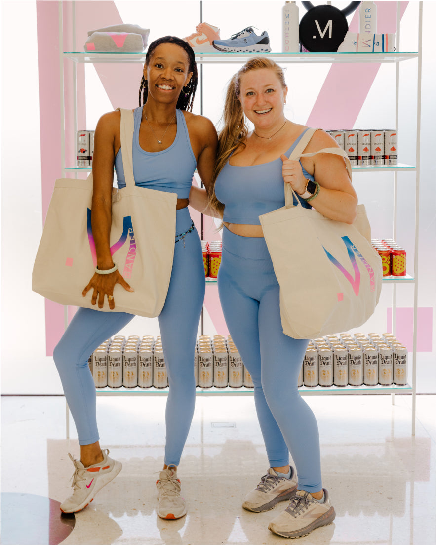 Women wearing blue All Access sport rib sets with The Method tote bags