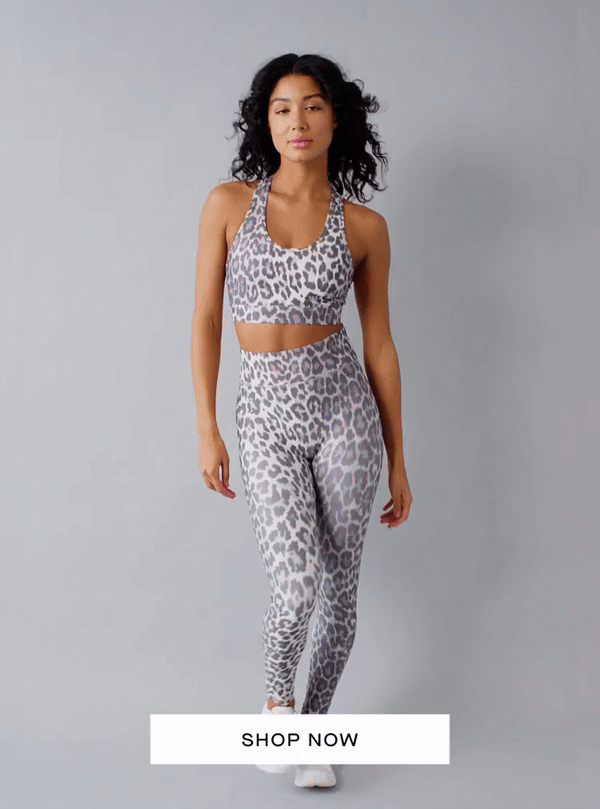 GIF of woman running across the screen on a grey background in different colors of the All Access Front Row Bra and Center Stage legging. The headline reads "Power Pairing" with a button underneath to "Shop New All Access"